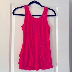 Cute ruffle back Iululemon Top.size 4. Hard to get a pic of color heather pink.